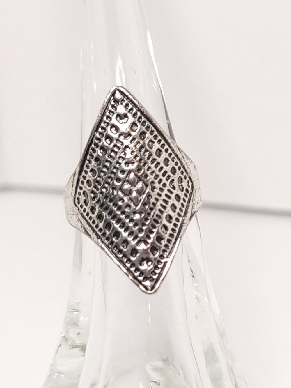 Silver Tone Ring With an Elongated Diamond Face